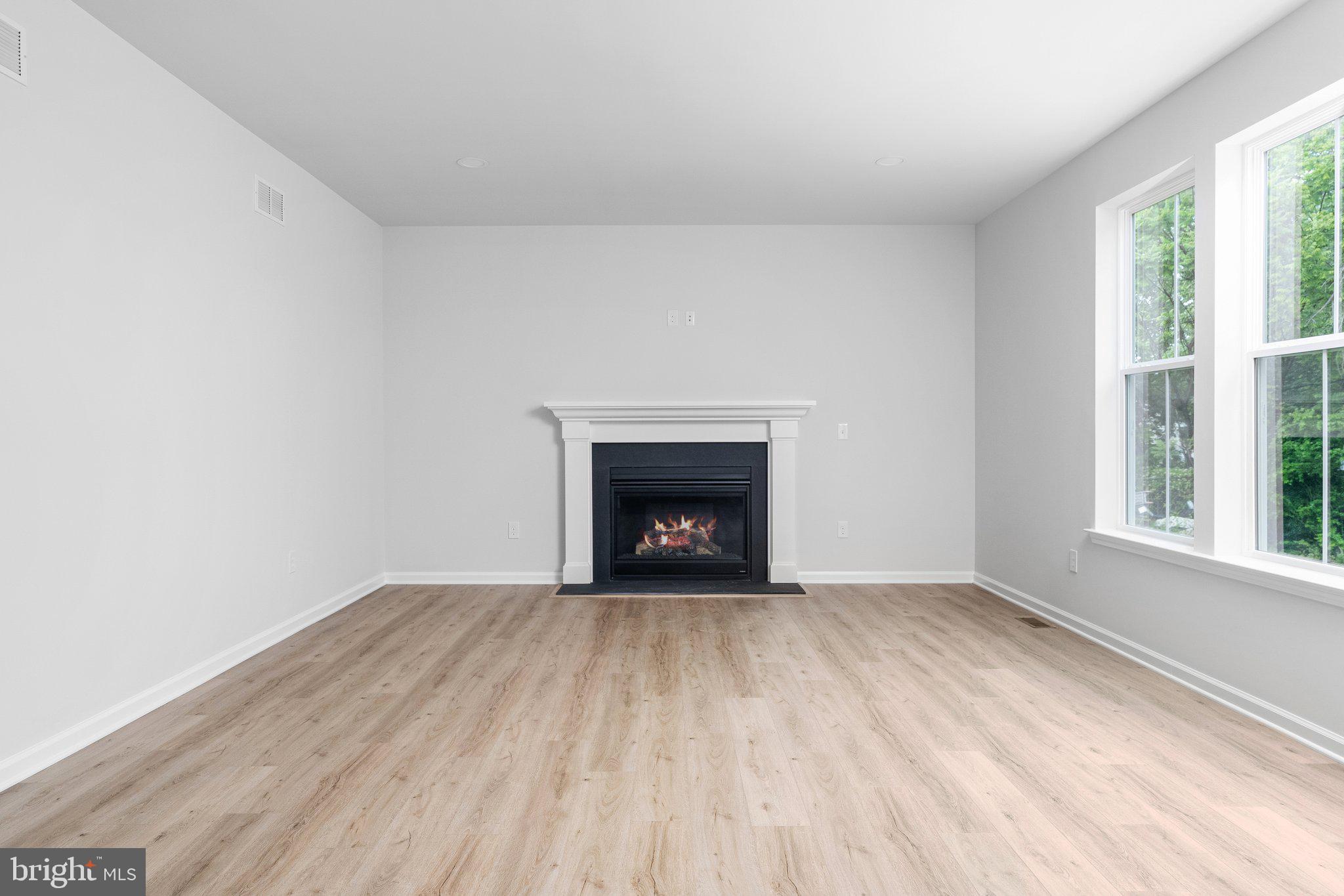 4913 South Broad Street Hamilton, NJ 08620 - Photo 18 of 31 a view of an empty room with a window and fireplace