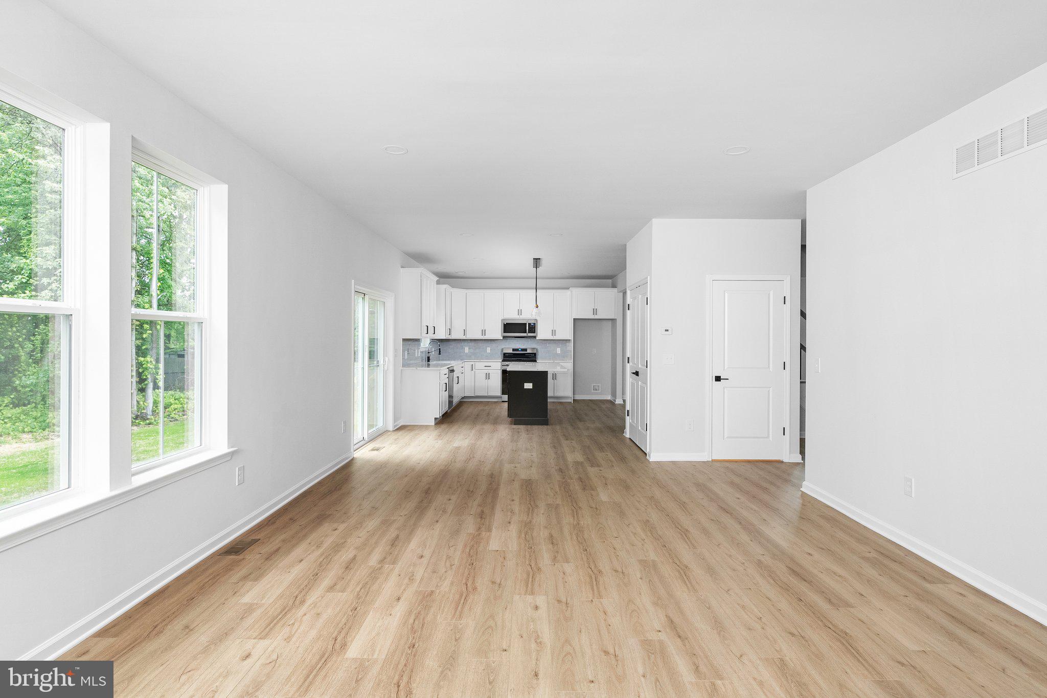 4913 South Broad Street Hamilton, NJ 08620 - Photo 21 of 31 a view of empty room with wooden floor and window
