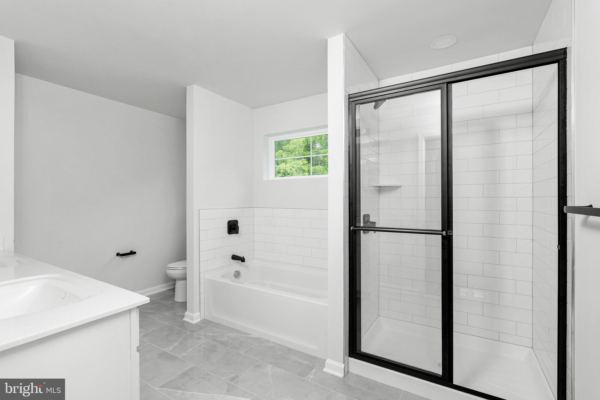 4913 South Broad Street Hamilton, NJ 08620 - Photo 28 of 31 a bathroom with a bathtub and a shower