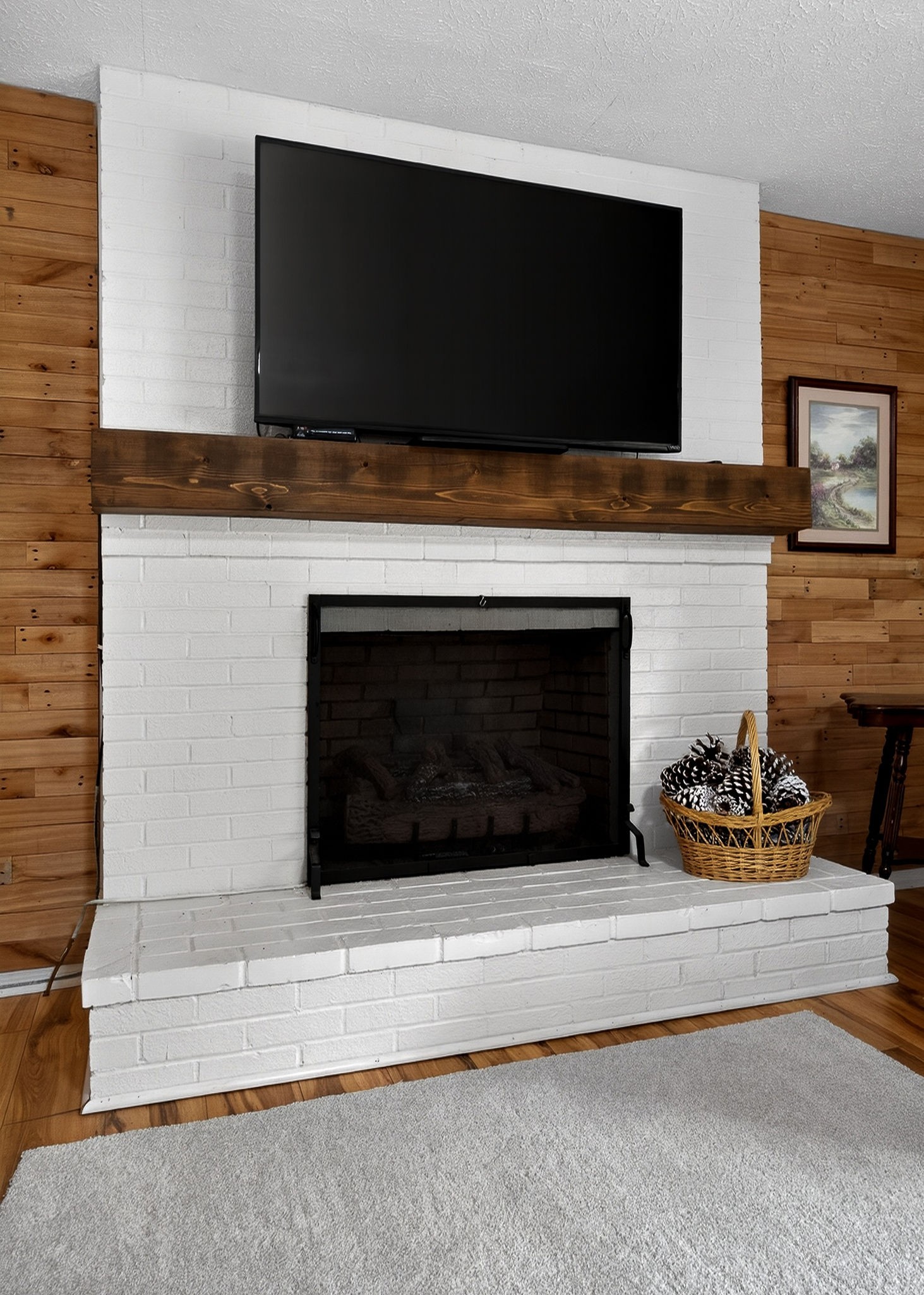 1755 Burgess Falls Road Sparta, TN 38583 - Photo 21 of 56 a living room with a fireplace and a flat screen tv