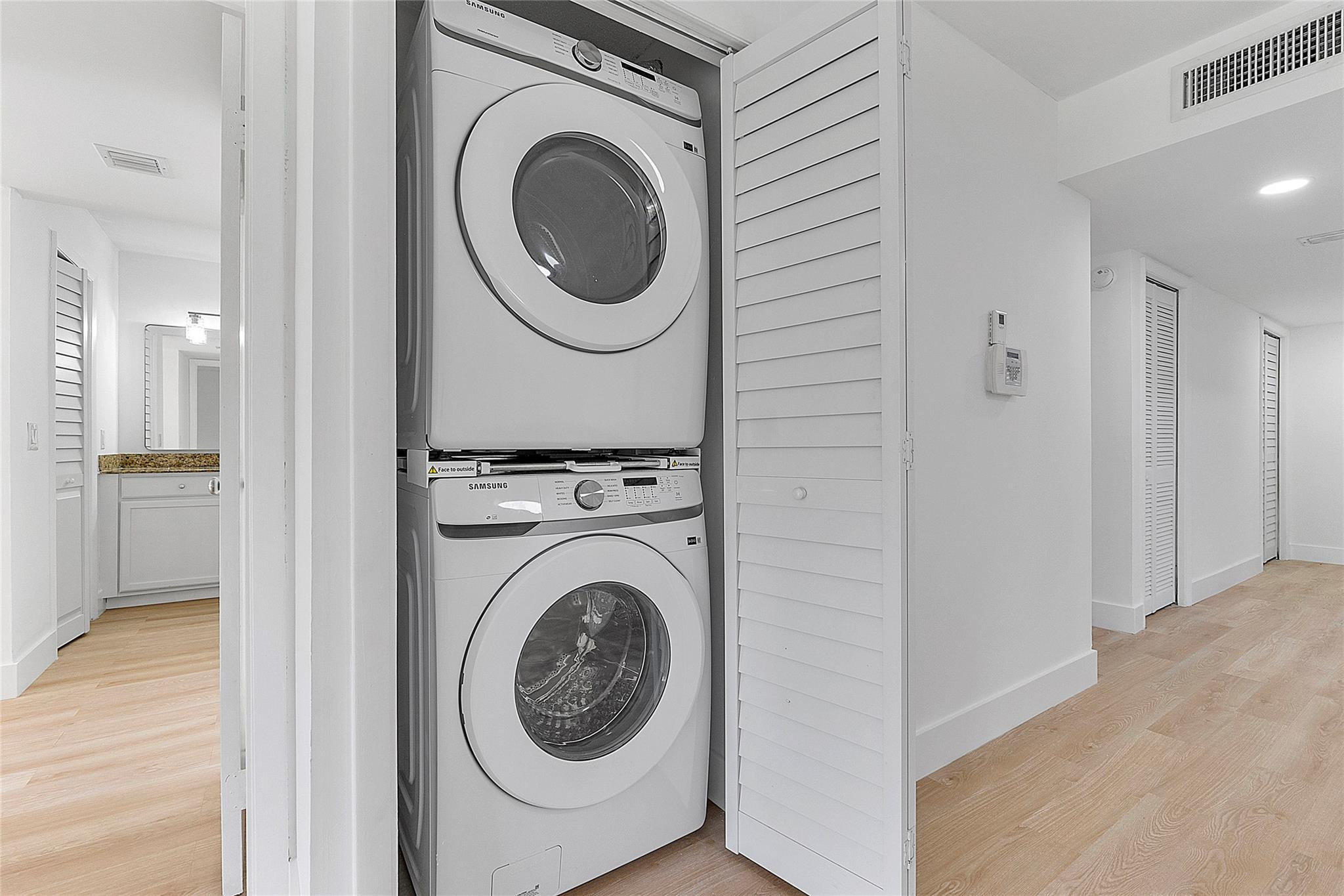 300 Racquet Club Road, Unit 105 Weston, FL 33326 - Photo 13 of 14 a view of a hallway with washer and dryer