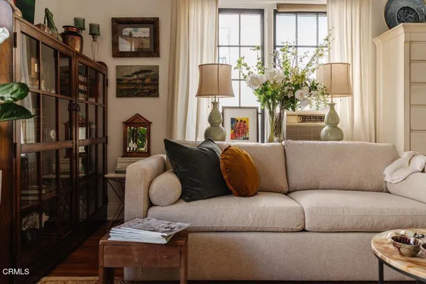 a living room with furniture and a large window