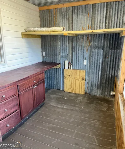 a view of outdoor space and wooden fence