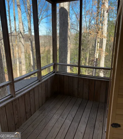 a view of balcony with wooden floor