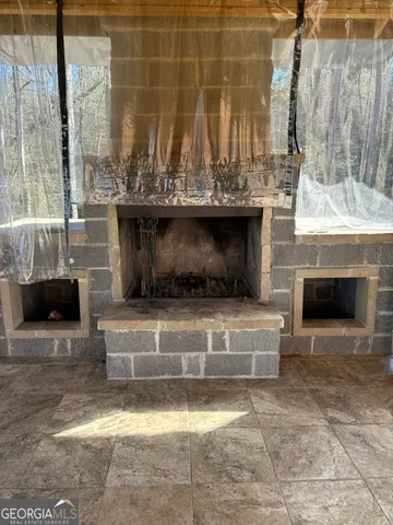 a living room with a fireplace and a fireplace