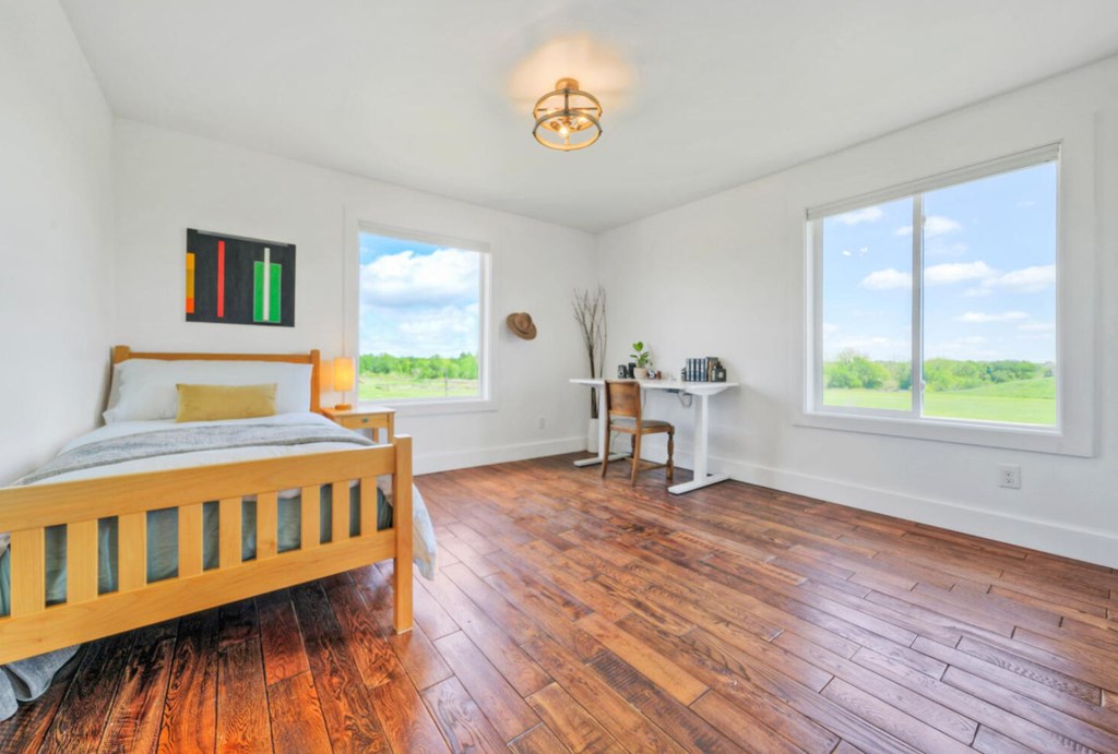 3 County Road, Unit 3 Elgin, TX 78621 - Photo 20 of 37 a bedroom with a bed and a window