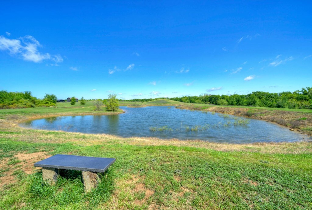 3 County Road, Unit 3 Elgin, TX 78621 - Photo 28 of 37 a view of a lake with houses in the back