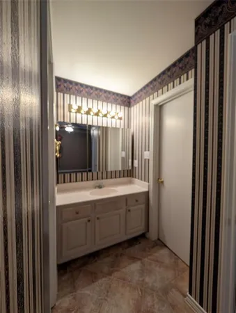 a bathroom with a double vanity sink and mirror