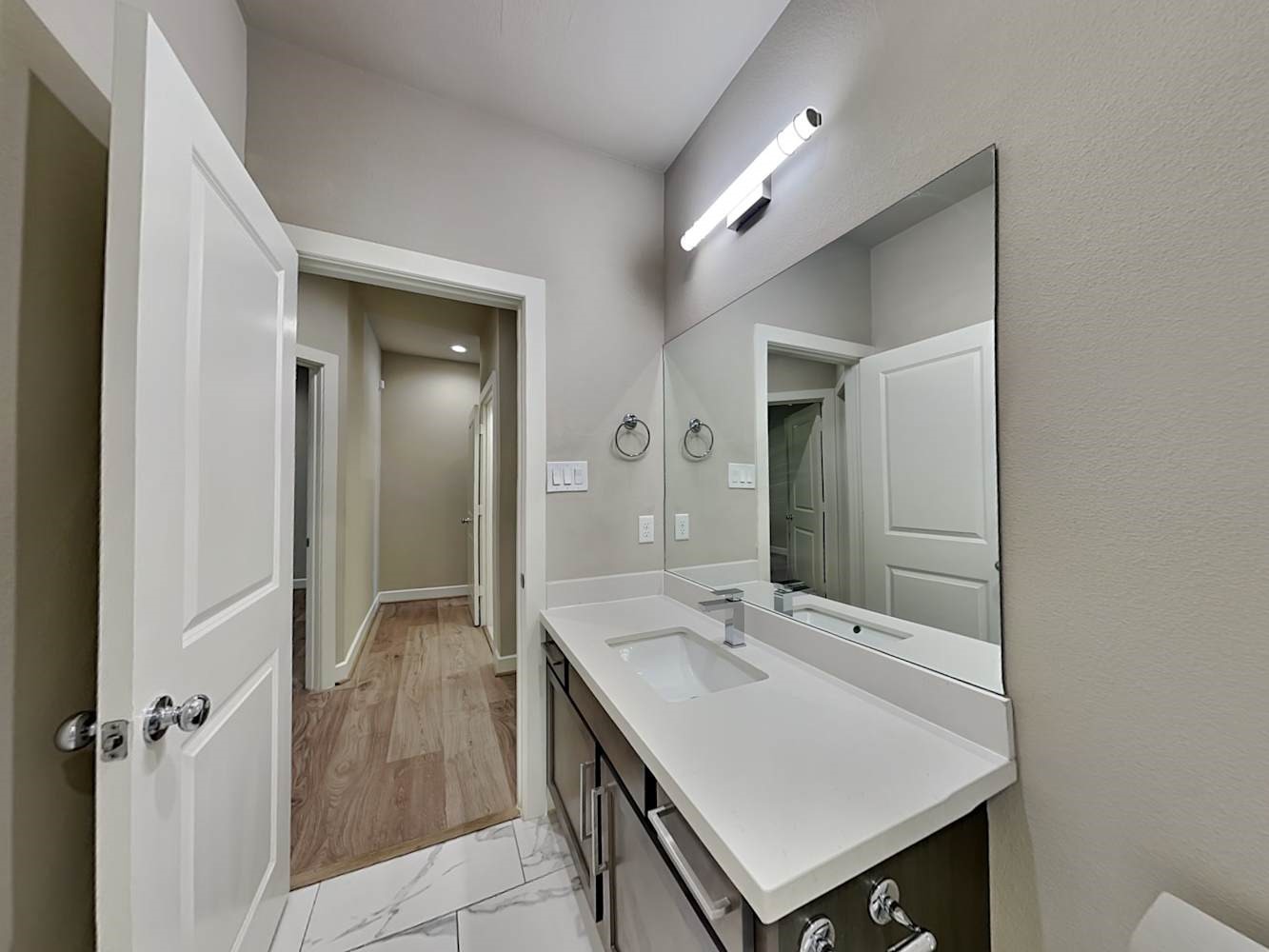 6347 Paddington Bend Drive Houston, TX 77008 - Photo 13 of 14 a bathroom with a sink a mirror and a shower