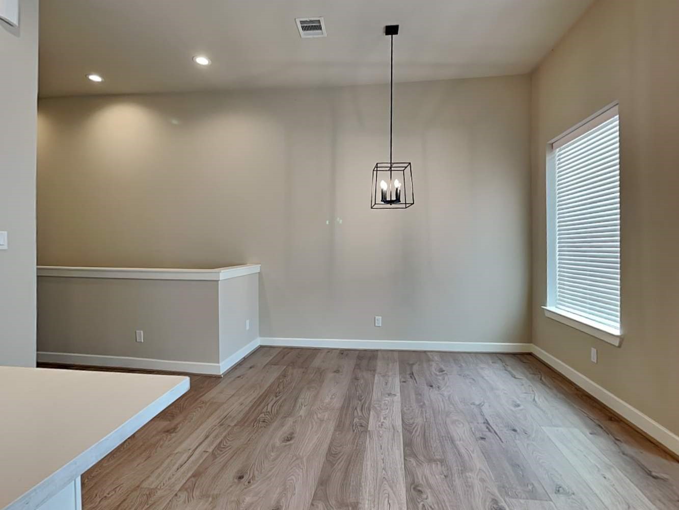 6347 Paddington Bend Drive Houston, TX 77008 - Photo 5 of 14 a view of empty room with wooden floor and fan
