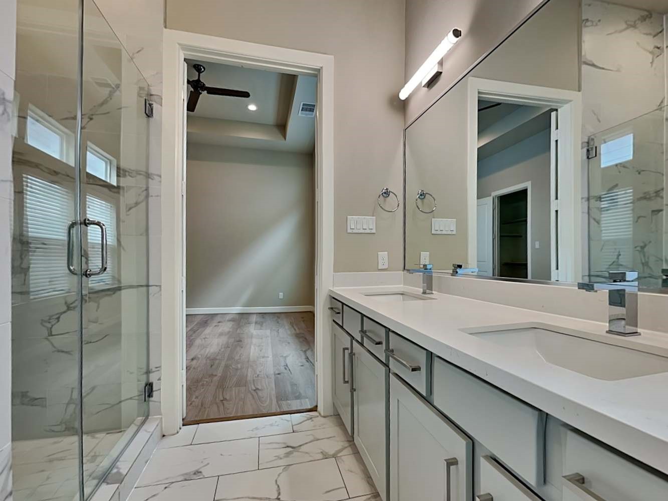 6347 Paddington Bend Drive Houston, TX 77008 - Photo 8 of 14 a bathroom with a granite countertop sink a mirror and shower