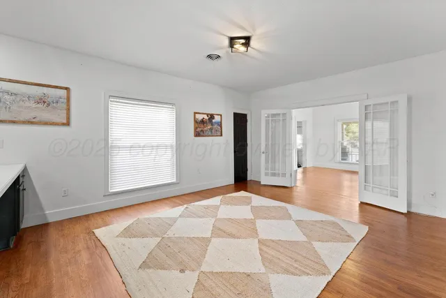 a big room with windows and closet
