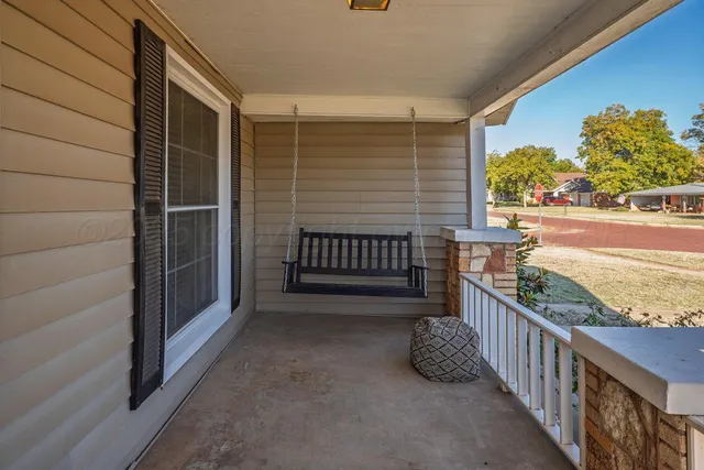 a view of balcony with furniture