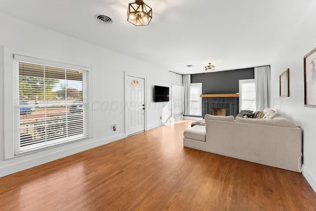 a living room with furniture and a large window
