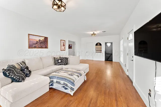 a spacious bedroom with a bed and a couch