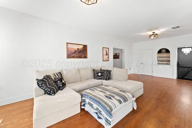 a spacious bedroom with a bed and window