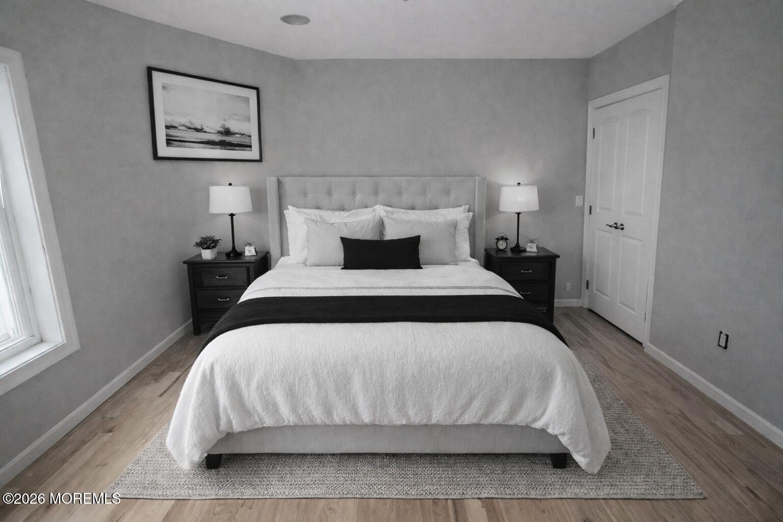 98 Raritan Avenue Keansburg, NJ 07734 - Photo 3 of 4 a bedroom with a bed and a window