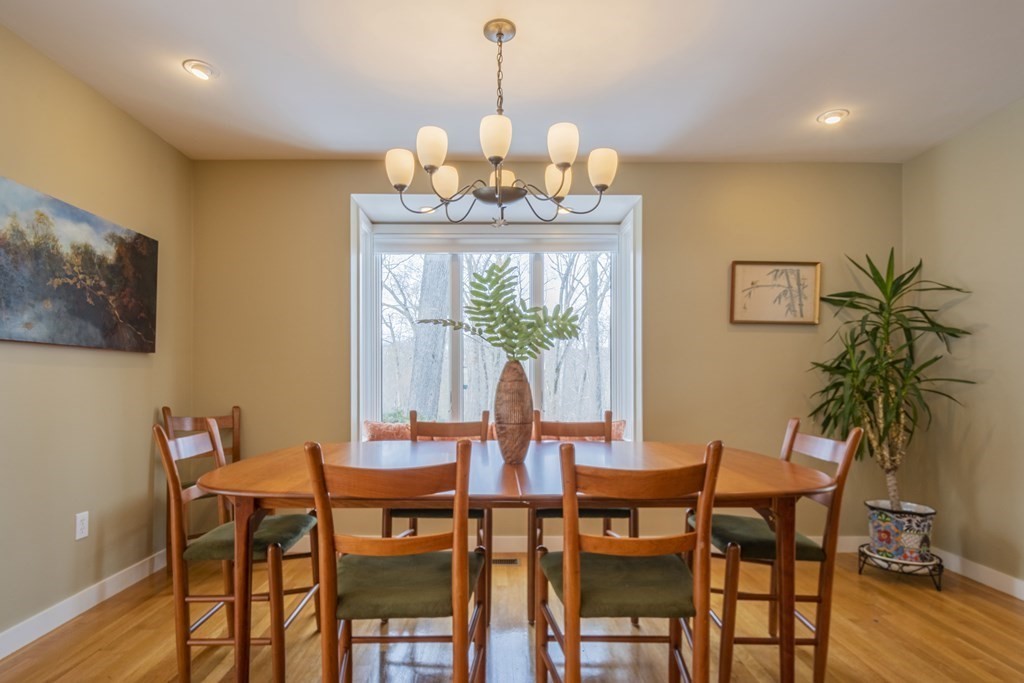 43 Baskin Road Lexington, MA 02421 - Photo 12 of 42 a view of a dining room with furniture window and wooden floor