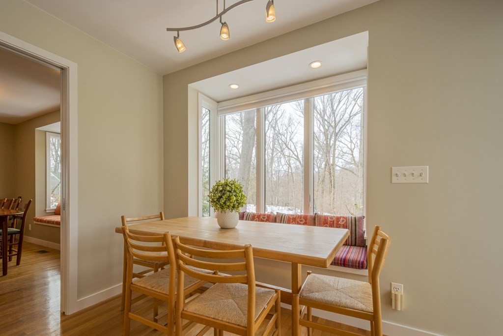 43 Baskin Road Lexington, MA 02421 - Photo 14 of 42 a view of a dining room with furniture window and wooden floor