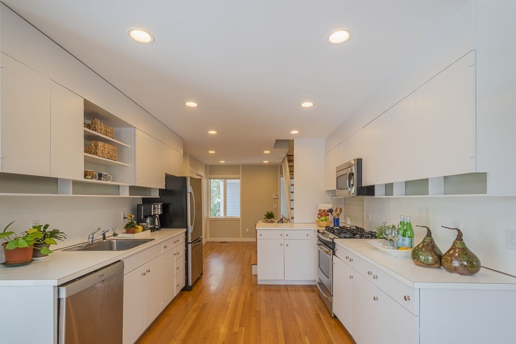 43 Baskin Road Lexington, MA 02421 - Photo 17 of 42 a large kitchen with stainless steel appliances lots of counter space and wooden floor