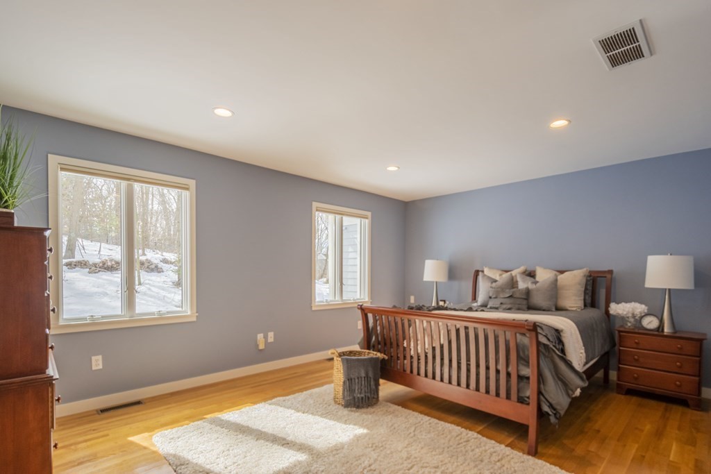 43 Baskin Road Lexington, MA 02421 - Photo 18 of 42 a bedroom with furniture and a window