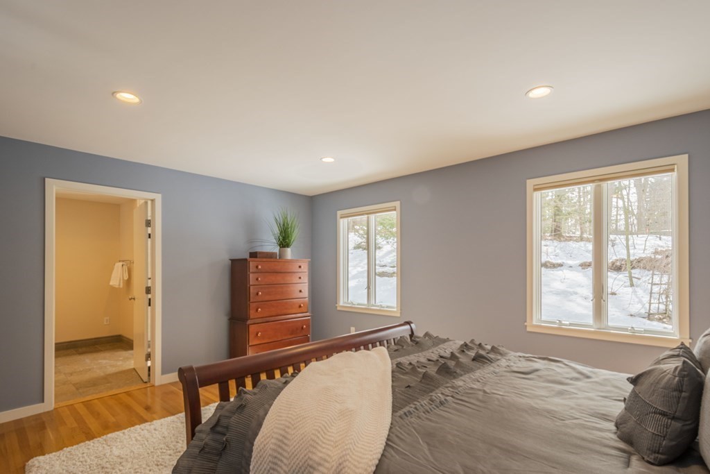 43 Baskin Road Lexington, MA 02421 - Photo 20 of 42 a bedroom with furniture and a window