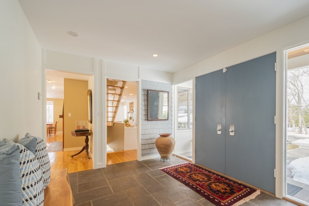 43 Baskin Road Lexington, MA 02421 - Photo 2 of 42 a living room with blue walls and next to a window