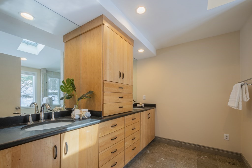 43 Baskin Road Lexington, MA 02421 - Photo 21 of 42 a kitchen with granite countertop a sink and cabinets
