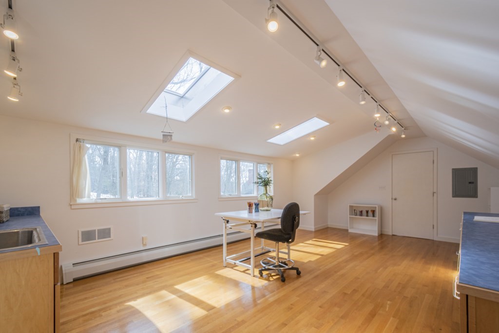 43 Baskin Road Lexington, MA 02421 - Photo 29 of 42 a workspace with wooden floor and a window