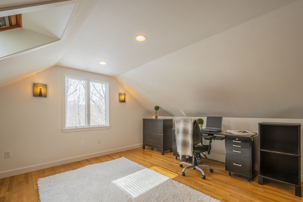 43 Baskin Road Lexington, MA 02421 - Photo 31 of 42 a view of a room with gym equipment and wooden floor