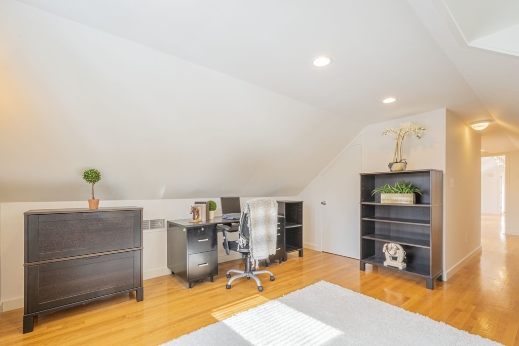 43 Baskin Road Lexington, MA 02421 - Photo 32 of 42 a room with a bed and furniture