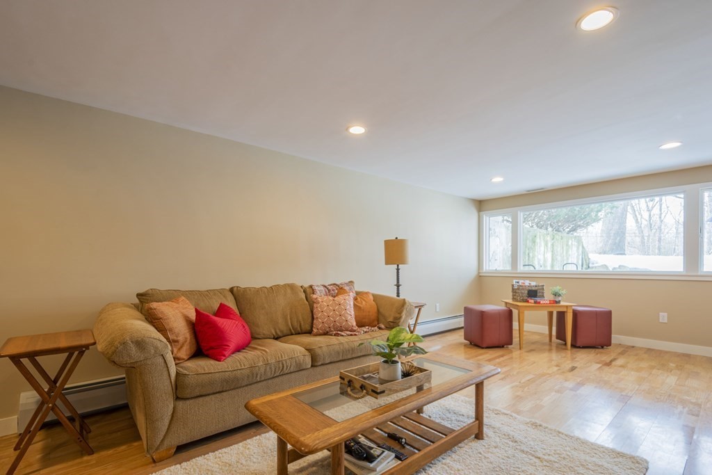 43 Baskin Road Lexington, MA 02421 - Photo 37 of 42 a living room with furniture and a large window