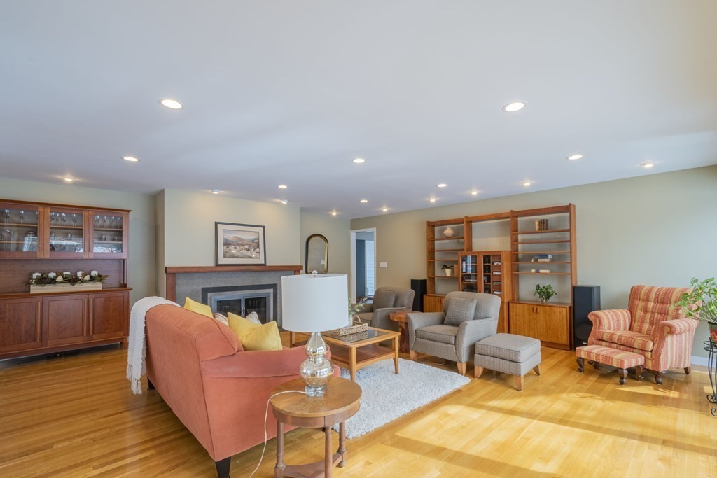 43 Baskin Road Lexington, MA 02421 - Photo 6 of 42 a living room with fireplace furniture and a wooden floor