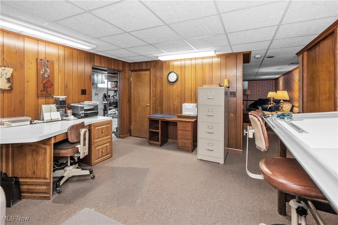 3158 Narrows Road Perry, OH 44081 - Photo 40 of 43 Office area featuring a paneled ceiling, wood walls, and light colored carpet