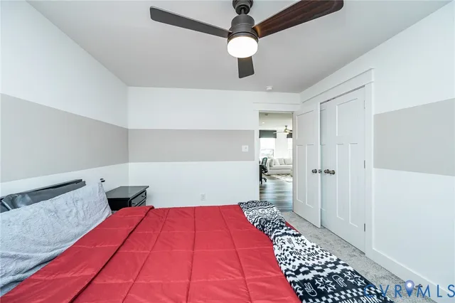 a bedroom with a bed and a walk in closet