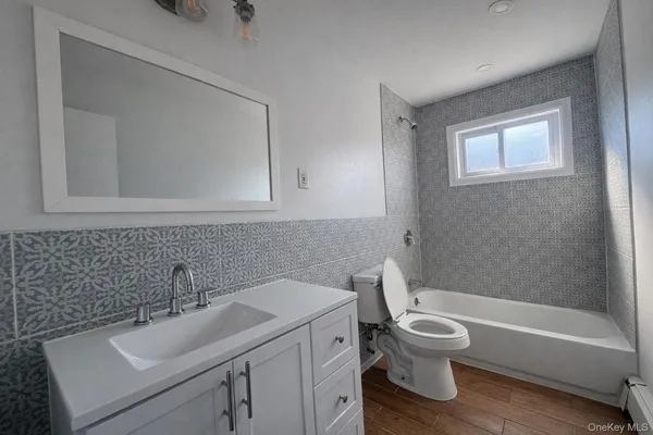 a bathroom with a sink toilet and a bathtub