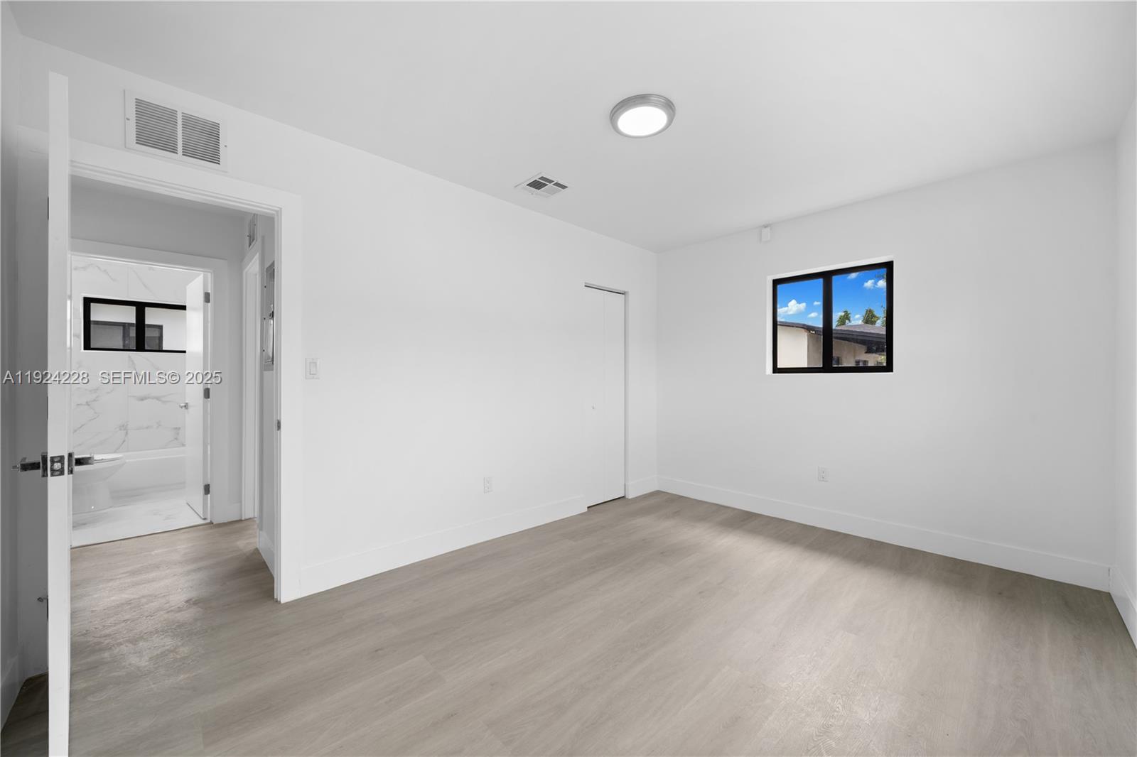 2983 Northwest 1st Street Pompano Beach, FL 33069 - Photo 16 of 28 wooden floor in an empty room