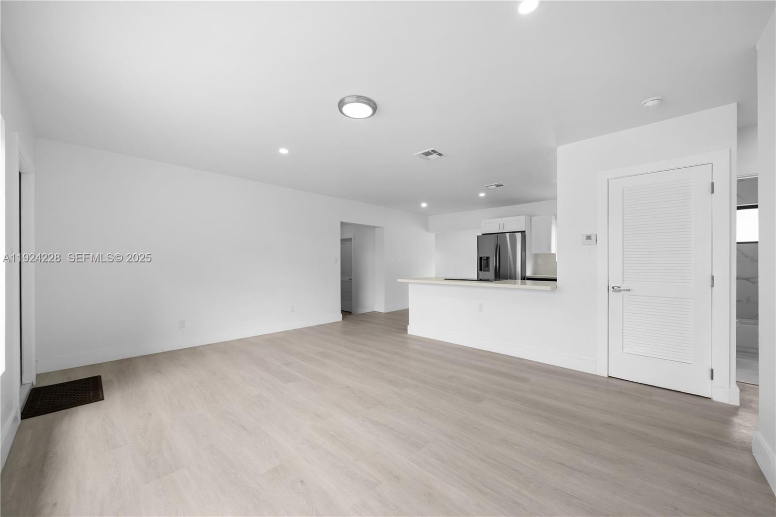2983 Northwest 1st Street Pompano Beach, FL 33069 - Photo 19 of 28 a view of kitchen with kitchen island and sink