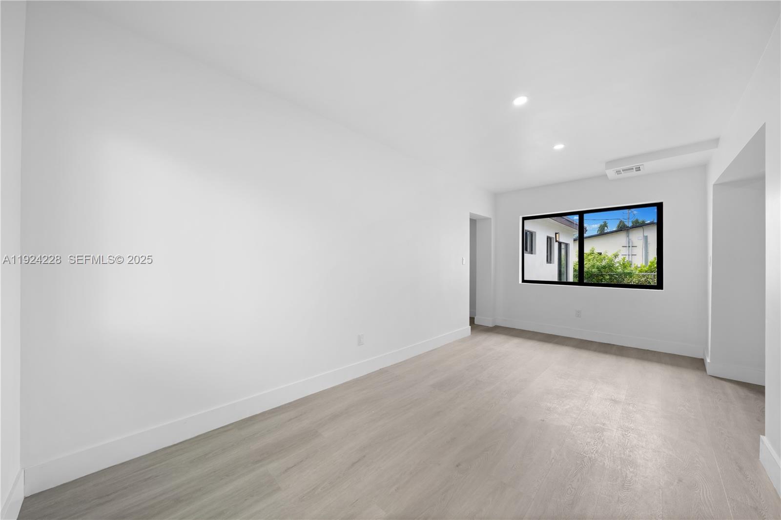 2983 Northwest 1st Street Pompano Beach, FL 33069 - Photo 21 of 28 a view of an empty room with windows