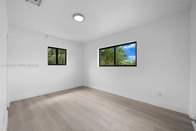 an empty room with windows