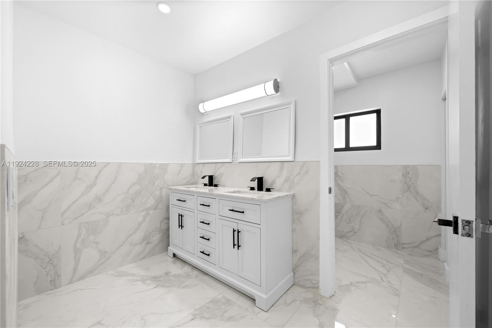 2983 Northwest 1st Street Pompano Beach, FL 33069 - Photo 10 of 28 walk in closet with window