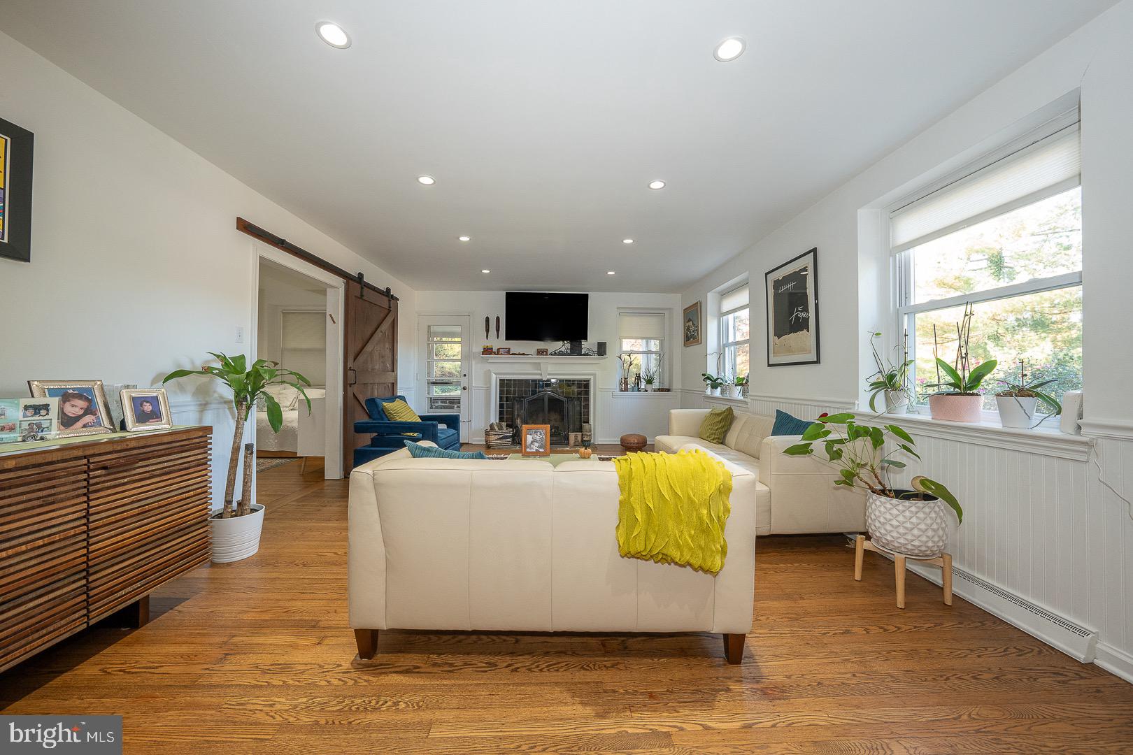 401 North Spring Mill Road Villanova, PA 19085 - Photo 11 of 76 a living room with fireplace furniture and a large window