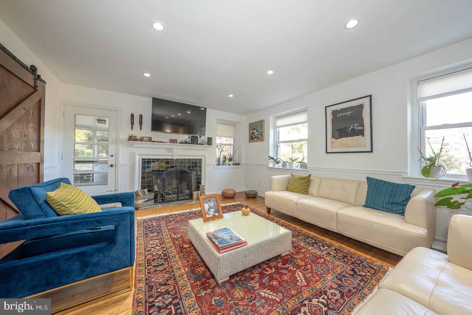 401 North Spring Mill Road Villanova, PA 19085 - Photo 13 of 76 a living room with furniture and a fireplace