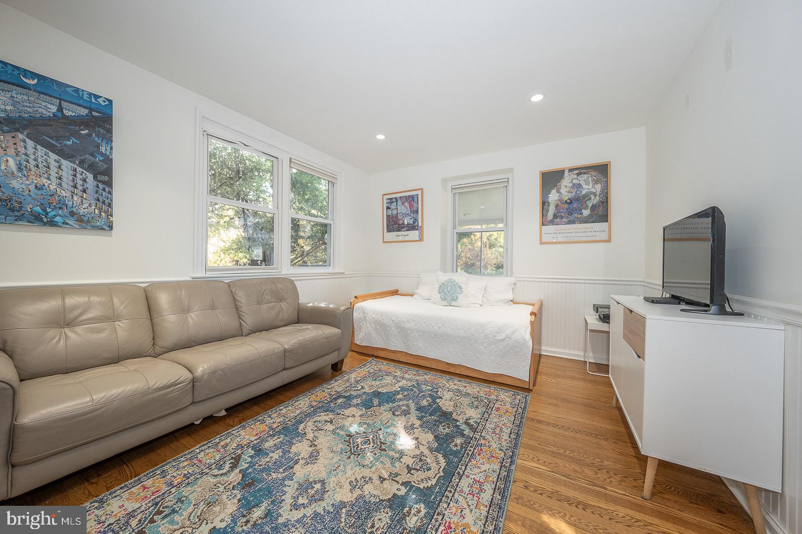 401 North Spring Mill Road Villanova, PA 19085 - Photo 17 of 76 a living room with furniture and a flat screen tv