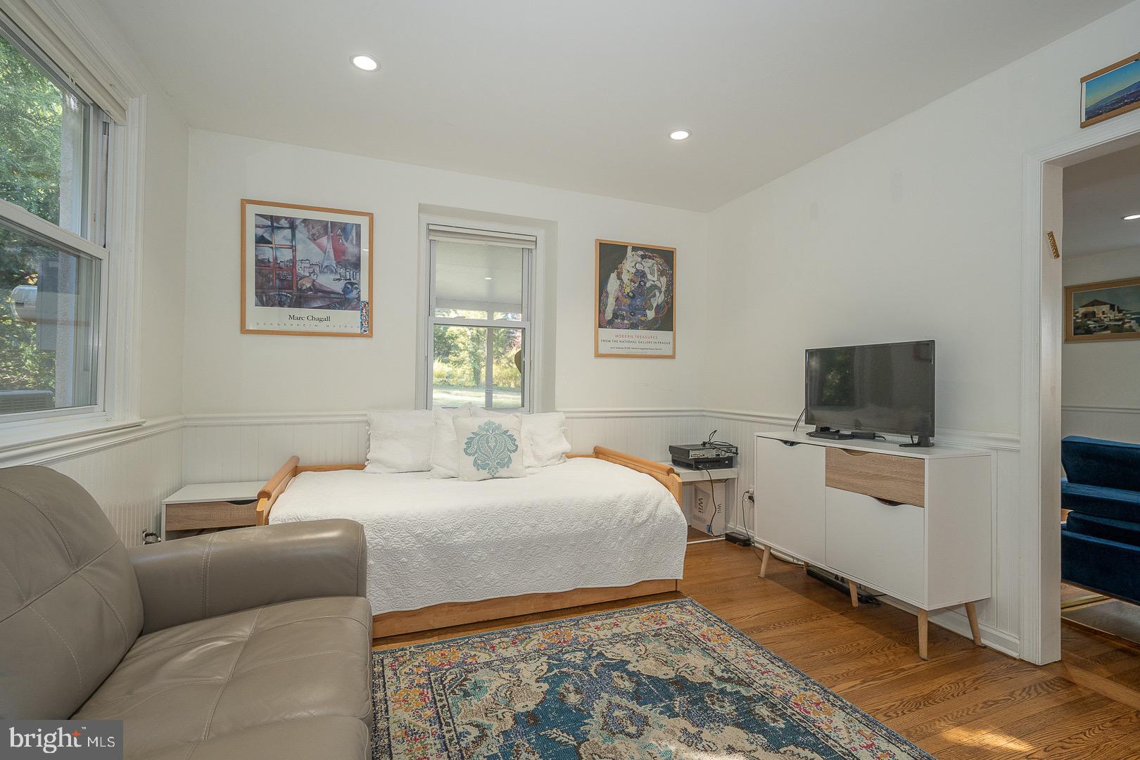 401 North Spring Mill Road Villanova, PA 19085 - Photo 19 of 76 a bedroom with a bed and a couch