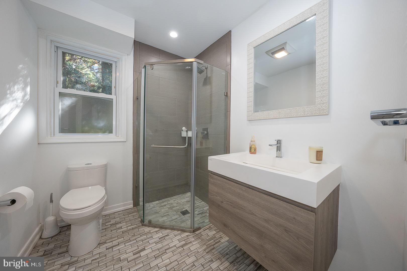 401 North Spring Mill Road Villanova, PA 19085 - Photo 21 of 76 a bathroom with a sink toilet and shower