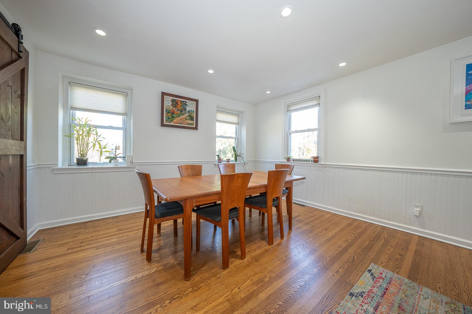 401 North Spring Mill Road Villanova, PA 19085 - Photo 25 of 76 a view of a dining room with furniture and wooden floor