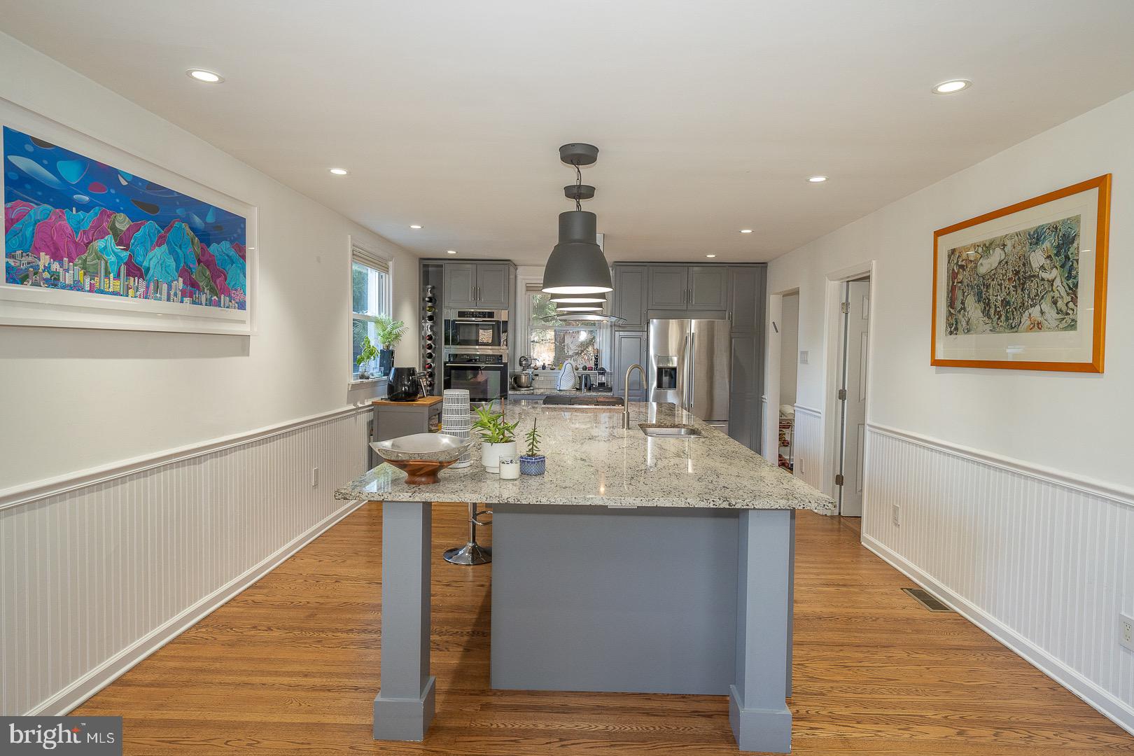 401 North Spring Mill Road Villanova, PA 19085 - Photo 28 of 76 a kitchen with stainless steel appliances granite countertop a sink and a refrigerator