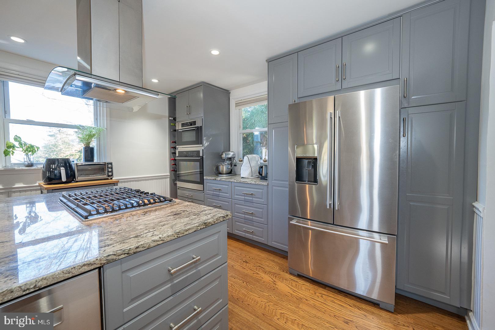 401 North Spring Mill Road Villanova, PA 19085 - Photo 32 of 76 a kitchen with stainless steel appliances granite countertop a refrigerator and a stove