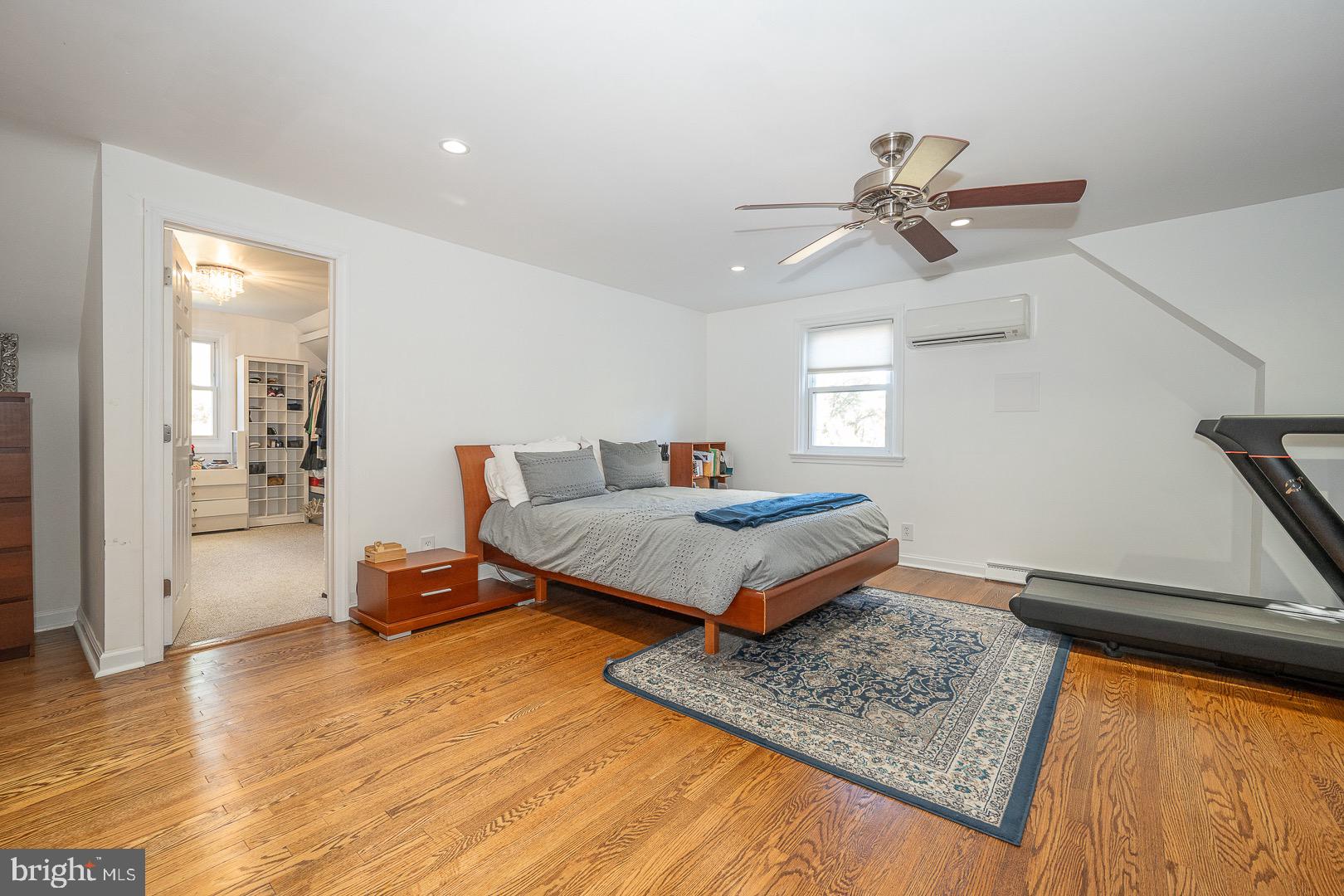 401 North Spring Mill Road Villanova, PA 19085 - Photo 40 of 76 a bedroom with a bed and wooden floor